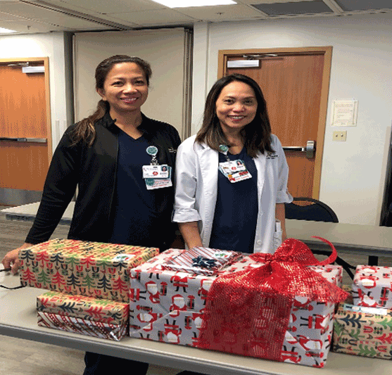 hospital staff with a pile of packages