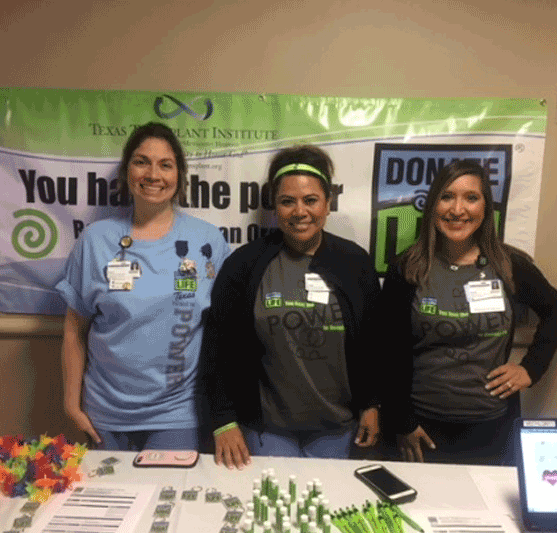 staffers in front of a Donate Life table