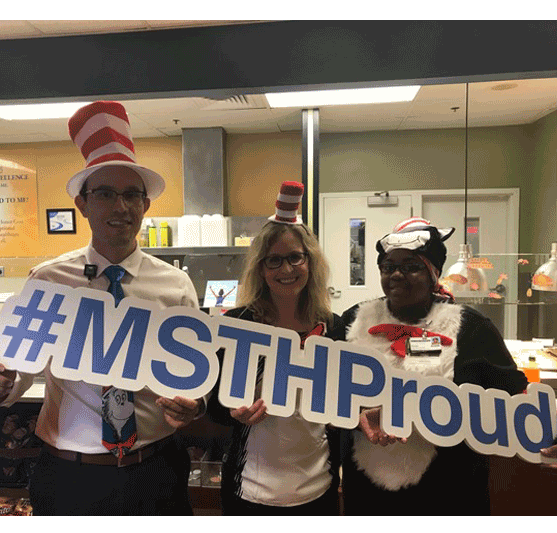 people in costumes carrying a #MSTHProud sign